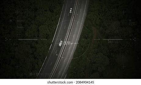 Aerial View Of Unmanned Aerial Vehicle UAV Or Reconnaissance Drone Monitoring Highway Traffic Tracking And Targeting Suspect Moving Vehicle