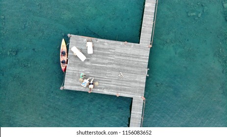 Aerial View Of Unrecognizable Young People In A Kayak Near A Boat Pier In Lake Tahoe