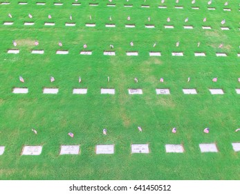 Aerial View Of US Military Cemetery In Houston, Texas, US. Endless Row Of White Marble Gravestones, Grave Markers With Flags And Flowers On Memorial Day To Honor Fallen Heroes In War, Military Service