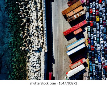 Aerial View Of Used Cars Lined Up In The Port For Import And Export.