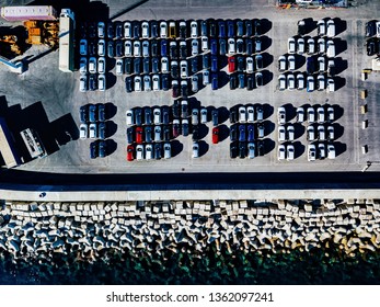 Aerial View Of Used Cars Lined Up In The Port For Import And Export.