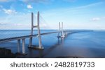 Aerial view of the Vasco da Gama Bridge is a cable-stayed bridge located in the city of Lisbon in Portugal and crosses the Tagus River. It is the second-longest bridge in Europe.