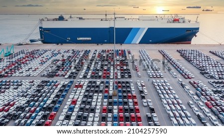 Aerial view vehicle carrier vessel loading car for shipping to worldwide, Large RoRo (Roll on off) vehicle car carrier, New car lined up in the port for import export around the world.