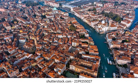 Aerial View Of Venice, Italy. Flying Above City Of Canals, Beautiful Bridges, Gondola Rides. The Capital Of Italy’s Veneto Region On Small Islands In A Lagoon In The Adriatic Sea With Gothic Buildings