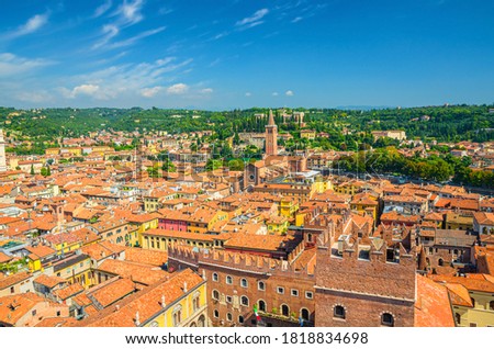 Aerial view of Verona city historical centre Citta Antica with red tiled roof buildings. Panoramic view of cityscape of Verona town. Blue sky background copy space. Veneto Region, Northern Italy Foto d'archivio © 