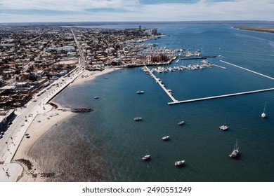 Aerial view of the vibrant coastal city of La Paz, Baja California Sur, Mexico, featuring the bustling marina, sandy beaches, boats, and urban landscape. The image captures the lively seaside  - Powered by Shutterstock