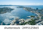 Aerial view of the vibrant harbor in Vladivostok during a clear sunny day