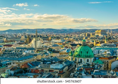 Aerial view of Vienna with tower of the town hall building, votivkirche and peterskirche churches from the stephansdom cathedral.