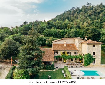 Aerial View Of Villa With Water Pool In Italy