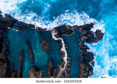 Aerial view of the village of Porto Moniz with lava-rock pool, Madeira Island, Portugal - Powered by Shutterstock