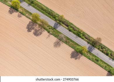 aerial view of village road and harvest fields in Poland