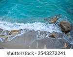 Aerial view of virgin hidden beach in greek island Lefkada, blue turquiose water waves