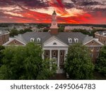 Aerial view of Virginia Hall, central building of Virginia State University public historically Black land-grant university in Ettrick with dramatic colorful sunset sky