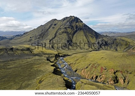 Aerial view of volcano and river in Fjallabak Nature Reserve, Iceland on sunny autumn day.