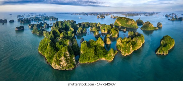 Aerial view Vung Vieng floating fishing village and rock island, Halong Bay, Vietnam, Southeast Asia. UNESCO World Heritage Site. Junk boat cruise to Ha Long Bay. Famous destination of Vietnam - Shutterstock ID 1477242437