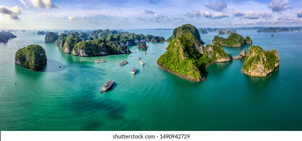 Aerial view Vung Vieng floating fishing village and rock island, Halong Bay, Vietnam, Southeast Asia. UNESCO World Heritage Site. Junk boat cruise to Ha Long Bay. Famous destination of Vietnam - Shutterstock ID 1490942729