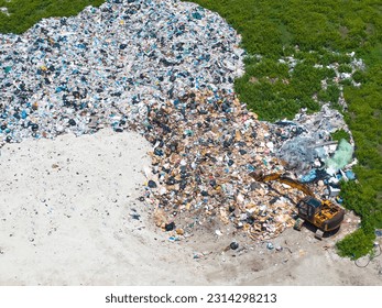 Aerial view waste dump, Waste from household in waste landfill disposal pile plastic garbage and various trash, Environmental pollution . - Powered by Shutterstock