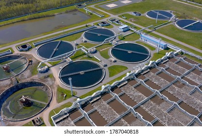 Aerial view of the wastewater treatment plant. Pumping station and drinking water supply. Industrial and urban water treatment for a big city. Round sedimentation tanks.