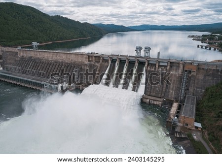 Aerial view of water discharge at hydroelectric power plant