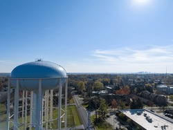 Aerial View Of A Water Tower In Upper Arlington, OH, With Columbus Skyline On The Horizon.