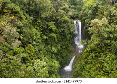 Aerial View Of A Waterfall Inside A Tropical Forest, Going Backwards