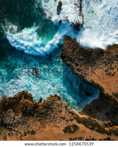 Similar – Aerial Drone View Of Dramatic Ocean Waves Crushing On Rocky Landscape