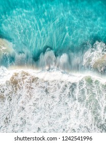Aerial view of waves crashing. Beautiful waves crashing in blue water