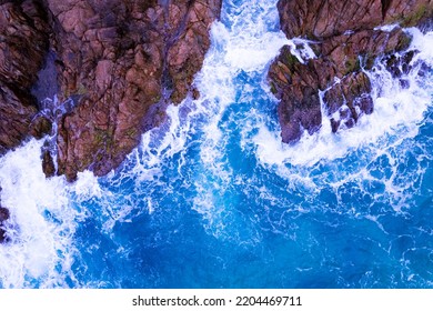 Aerial View Of Waves Crashing On Rocks,Seascape With Birds Eye View Shot Over Ocean Waves Image For Nature Background And Travel Background,Amazing Seashore At Phuket Island Thailand