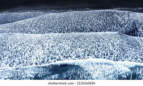 Aerial View Of Waves On The Black Sand Beach At Vestrahorn, Southern Iceland. Drone Shot From Directly Overhead. 