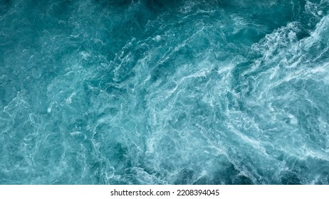 Aerial view of the waves and rapids of the wild river, close-up, top shot - Shutterstock ID 2208394045