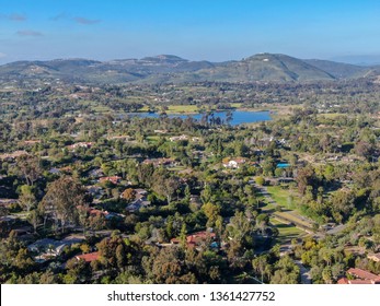Aerial view of wealthy countryside area with luxury villas with swimming pool, surrounded by forest and mountain valley. Ranch Santa Fe. San Diego, California, USA.  03/19/2019