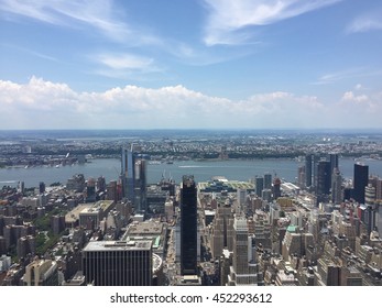 Aerial view of the West side of Manhattan New York City with Hudson River, view of New Jersey.  Javitz Center and Hudson Yards in the middle of shot.