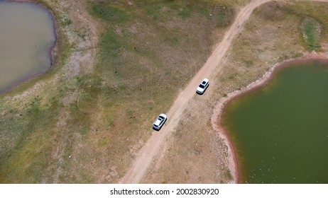 Aerial View Of White Cars Are Running Against Each Other In Opposite Directions.