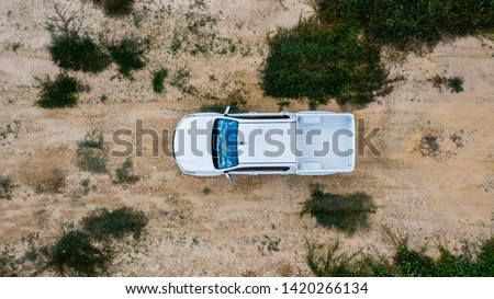 Aerial view white off-road car vehicle, Car 4x4 wheel drives off-road on safari, White truck car park on sand.