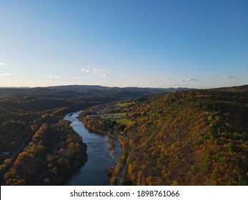 Aerial View Of The White River In Hartford, Vermont During Peak Foliage