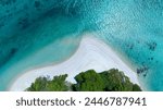 The aerial view of white sand beach tropical with seashore as the island in a coral reef ,blue and turquoise sea Amazing nature landscape with blue lagoon