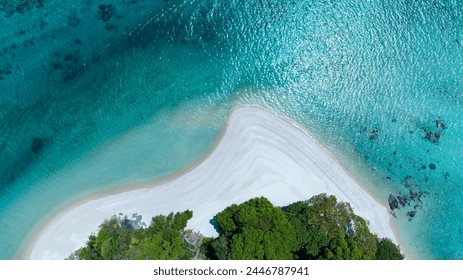 The aerial view of white sand beach tropical with seashore as the island in a coral reef ,blue and turquoise sea Amazing nature landscape with blue lagoon - Powered by Shutterstock