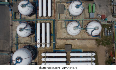 Aerial View White Storage Tank Gas In Station LPG Gas, LNG Or LPG Distribution Station Facility, Oil And Gas Fuel Manufacturing Industry.