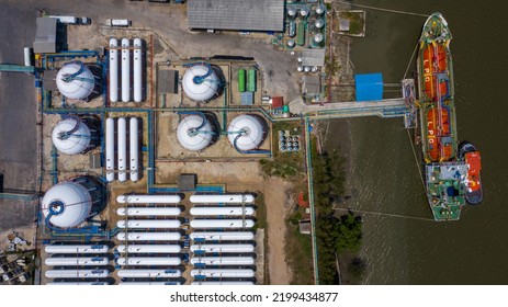 Aerial View White Storage Tank Gas In Station LPG Gas, LNG Or LPG Distribution Station Facility, Oil And Gas Fuel Manufacturing Industry.