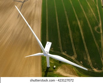 Aerial View Of A Wind Turbine In A Agriculture Field