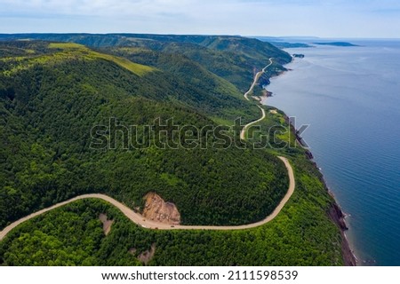 Aerial view of the winding Cabot Trail road seen from high above on the Skyline Trail in Cape Breton Island, Nova Scotia