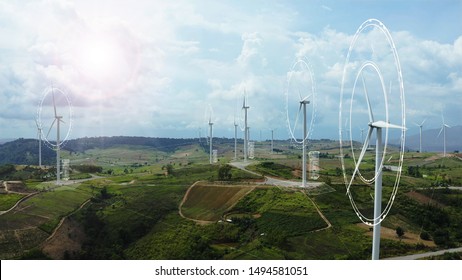 Aerial View Of Windmills With Digitally Generated Holographic Display Tech Data Visualization. Wind Power Turbines Generating Clean Renewable Energy For Sustainable Development In A Green Ecologic Way