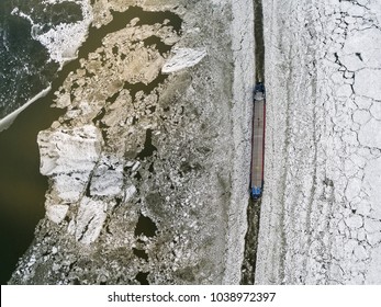 Aerial View In The Winter Of A Large Boat Breaking Through The Ice At Ice Sea Markermeer, Holland.