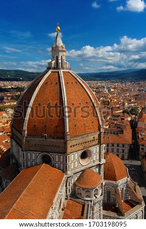 Aerial view of wonderful dome of Santa Maria del Fiore (St Mary of the Flower) in Florence with tourists at the top, built by italian architect Brunelleschi in 15th century and symbol of Renaissance