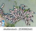 Aerial view of wooden passenger boats along the Buriganga River, Keraniganj, Dhaka, Bangladesh.