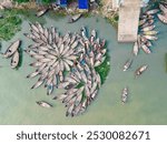 Aerial view of wooden passenger boats along the Buriganga River, Keraniganj, Dhaka, Bangladesh.