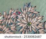 Aerial view of wooden passenger boats along the Buriganga River, Keraniganj, Dhaka, Bangladesh.