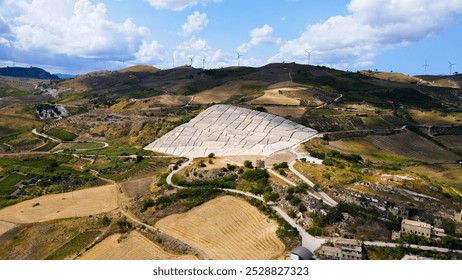 Aerial view of the work of art called Cretto di Burri and the surrounding countryside. Drone Birds Eye of texture stones from above in Sicily, province of Trapani, south Italy. Abstract design paths - Powered by Shutterstock