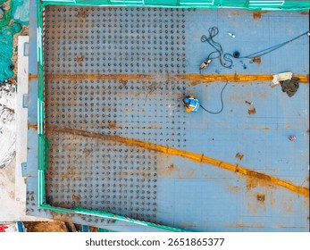 Aerial view of worker welder welds the steel overpass bridge construction