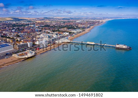 Aerial view of Worthing, England showing Worthing Pier, Ferris Wheel and beach